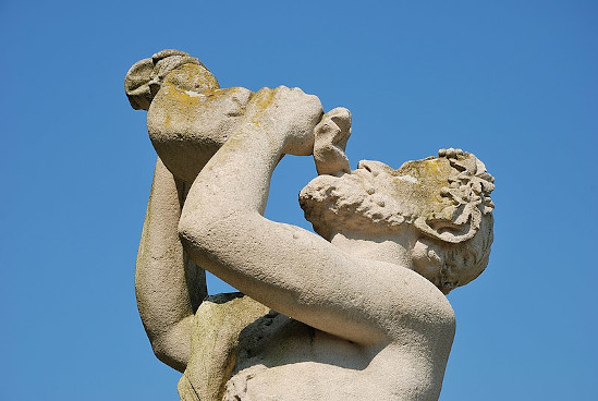 statue of a man drinking thirstily
